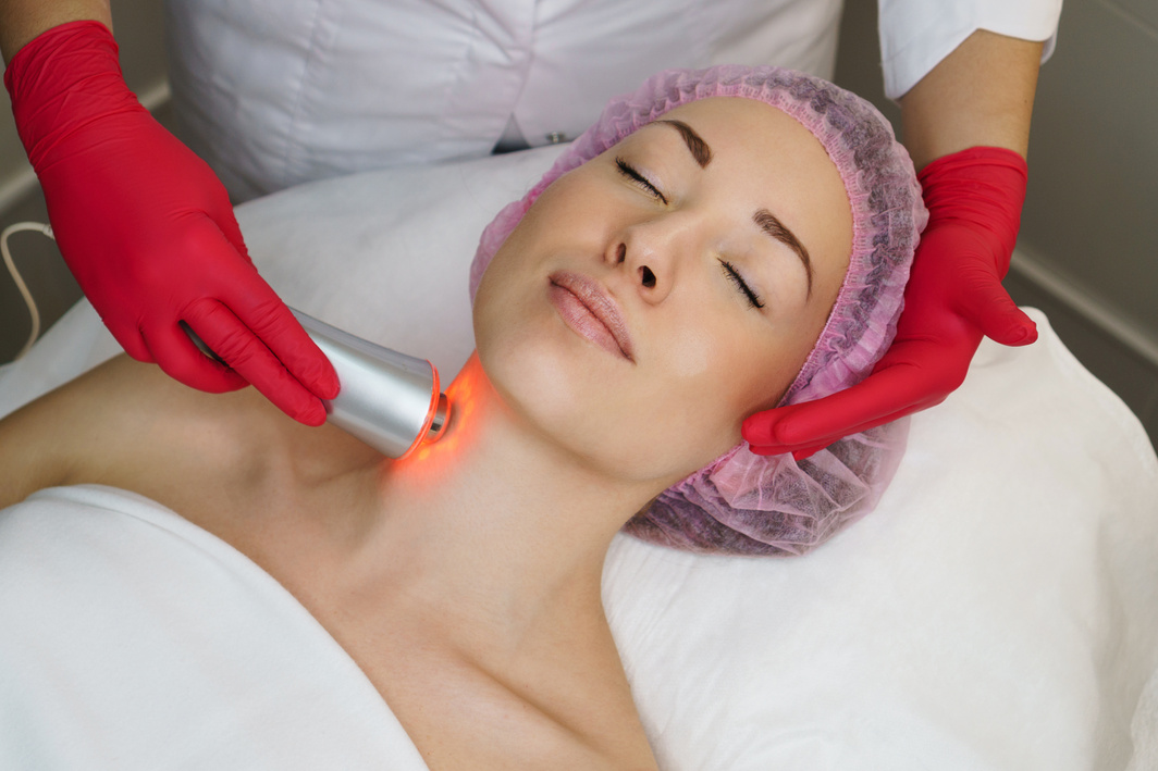 Young Woman Undergoing Ultrasound Chromotherapy