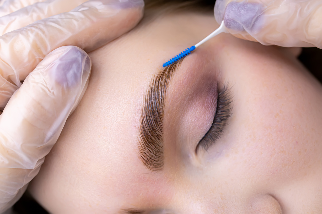 Combing the Hairs after Laminating the Eyebrows with a Blue Brus