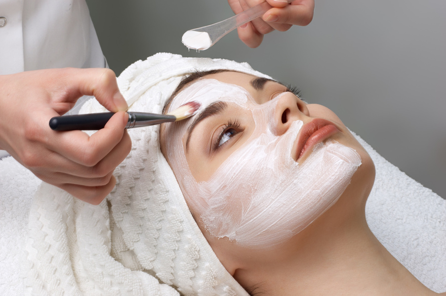 A facial mask being applied at a salon