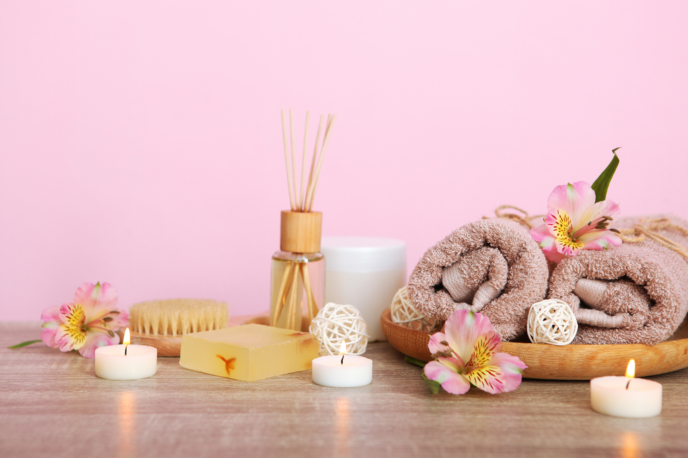spa composition with towels and care products on the table with place for text. Body care, relaxation