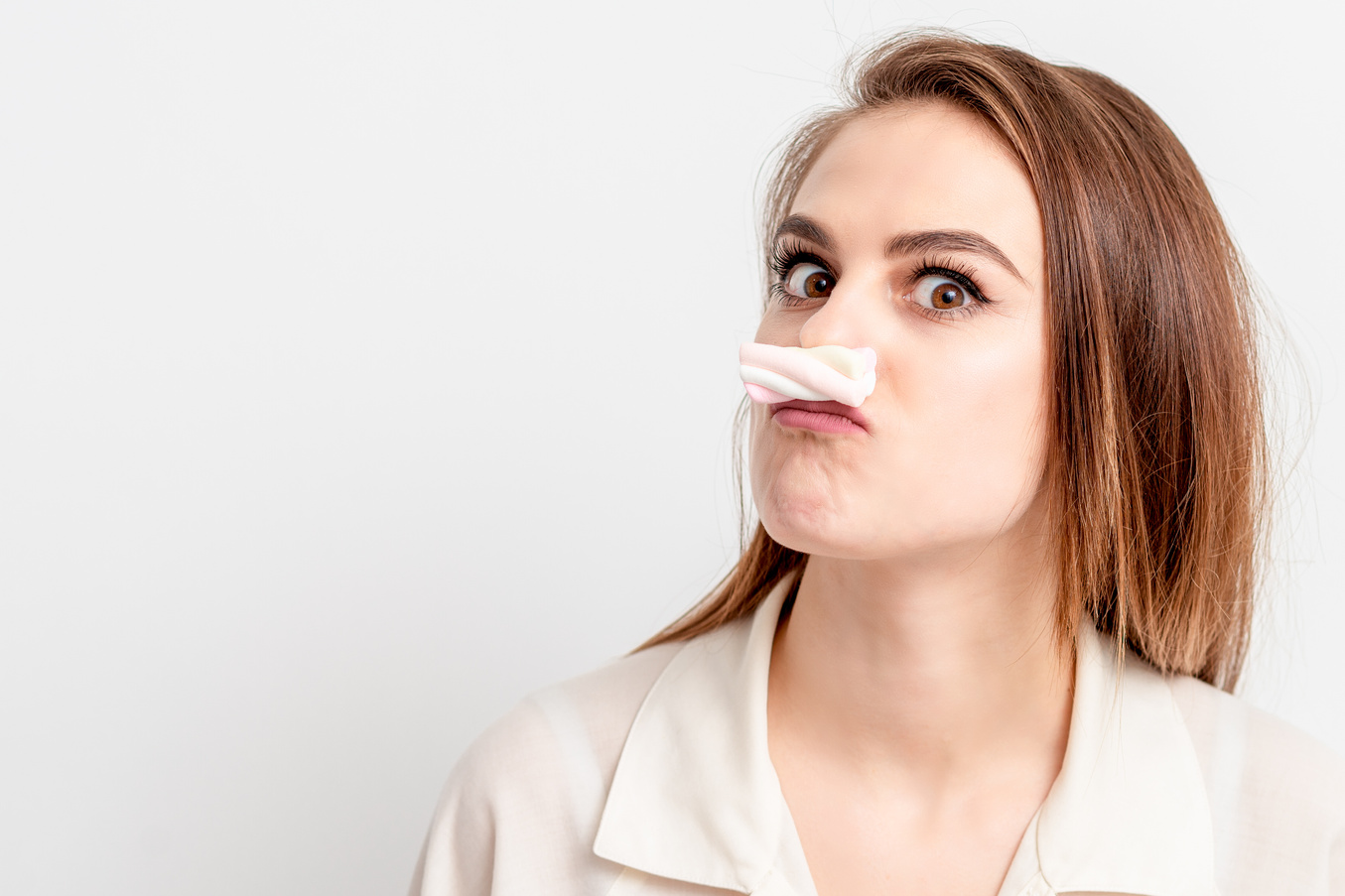Woman Makes Marshmallow Mustache.