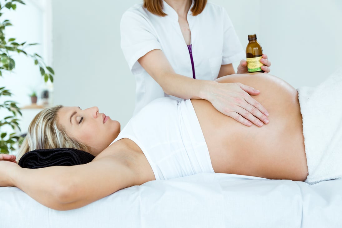 Pregnant Woman Having a Massage in a Spa